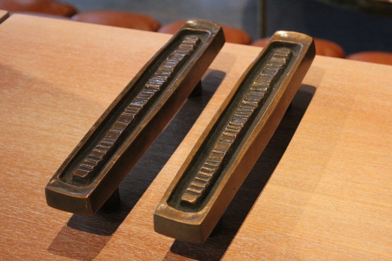A pair of nicely patinated bronze door handles/hardware designed by Forms and Surfaces.