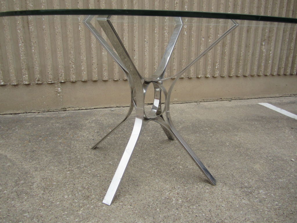 Polished stainless steel dining table by Dunbar at 1stdibs