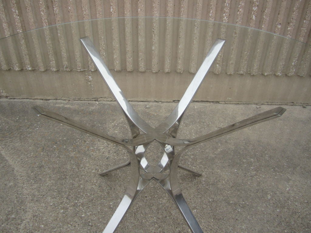 Polished stainless steel dining table by Dunbar at 1stdibs