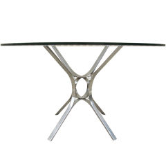 Polished stainless steel dining table by Dunbar