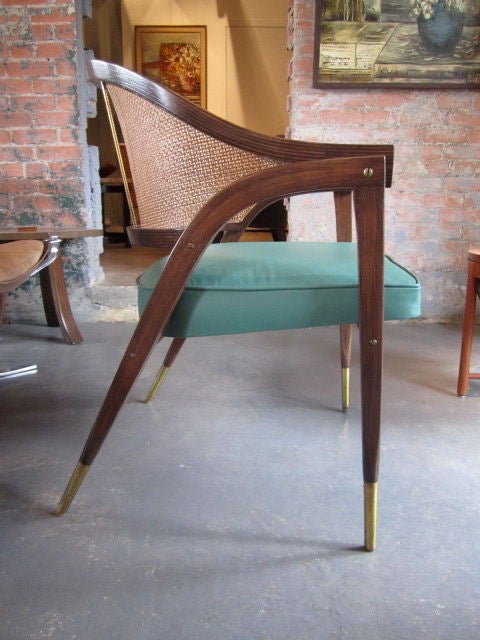 Caned back arm chair with brass sabots and vintage Spinneyback leather.  Designed by Edward Wormley for Dunbar.