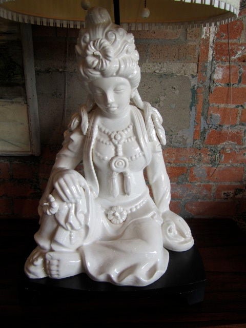 Large porcelain statue sitting atop a stand with original Maria Kipp shade.