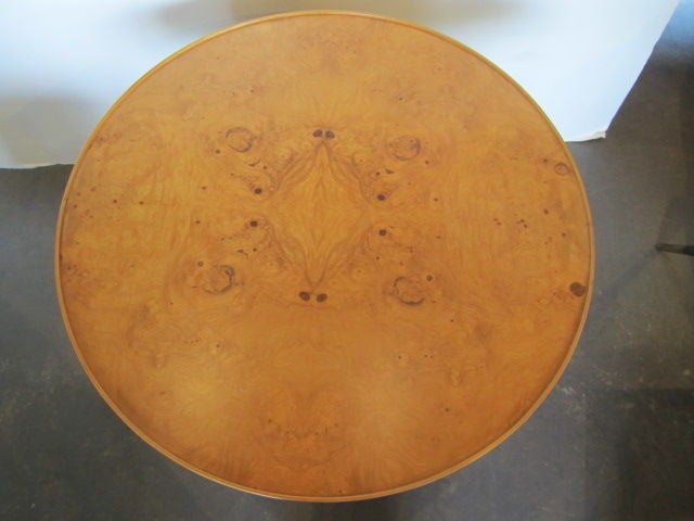 Large occasional table with storage. Made of Olive-wood burl with a brass 