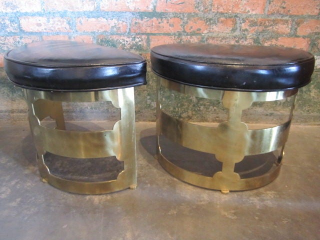 A pair of matching brass stools with original leather tops. Designed by Grosfeld House