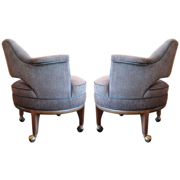 A pair of swivel chairs on casters. Designed by Maurice Bailey for Monteverdi-Young. Newly upholstered with leather trim.