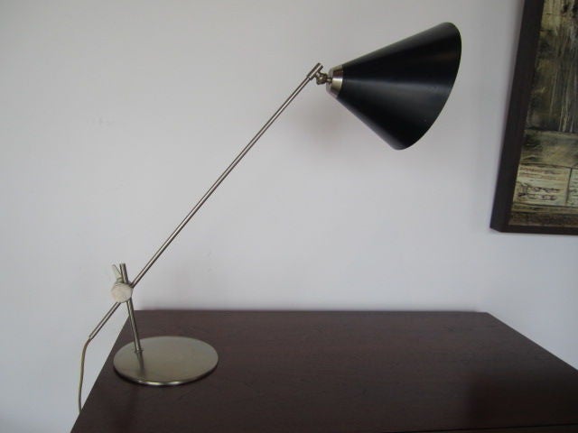 A very smart desk lamp with articulating cone head and adjustable base. Beautifully made and very versatile. In the style of Arteluce or Arredoluce.