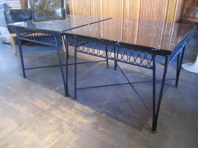 A large pair of iron and marble end tables designed by Tempestini for Salterini.