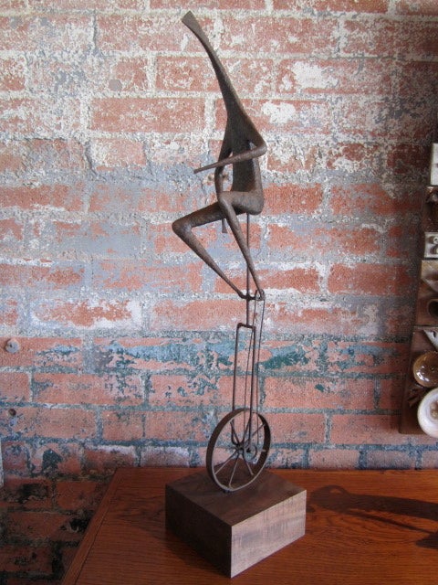 A large pair of metal unicyclist sculptures by Jack Boyd. Priced and sold individually. Smaller 16.5h x 12 x 15<br />
<br />
Jack Boyd became well known in San Diego for his jewelry and sculpture. With no formal art training, Boyd had an early