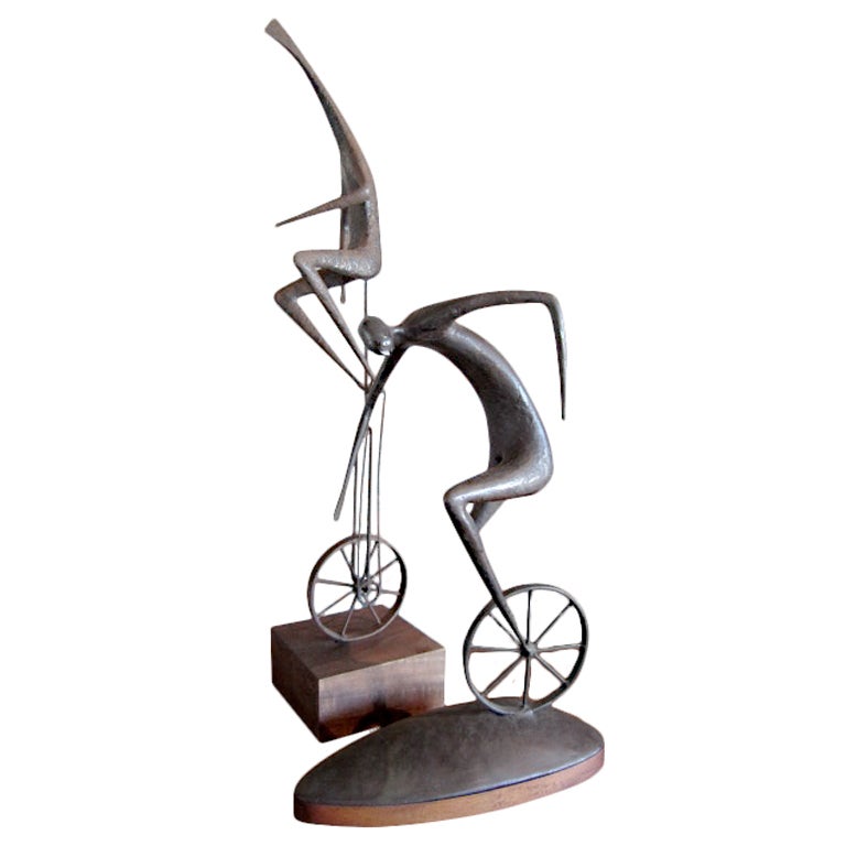 Pair of unicycle sculptures by Jack Boyd