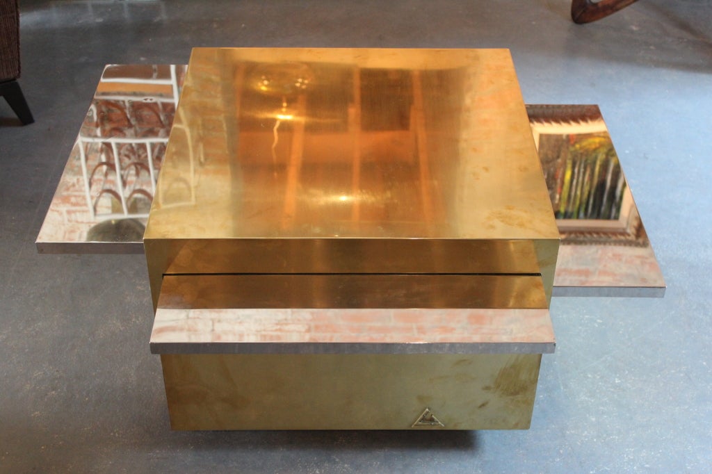 The magic cube table designed by Gabriella Crespi. This version in brass with polished chrome sliding shelves and two signatures.