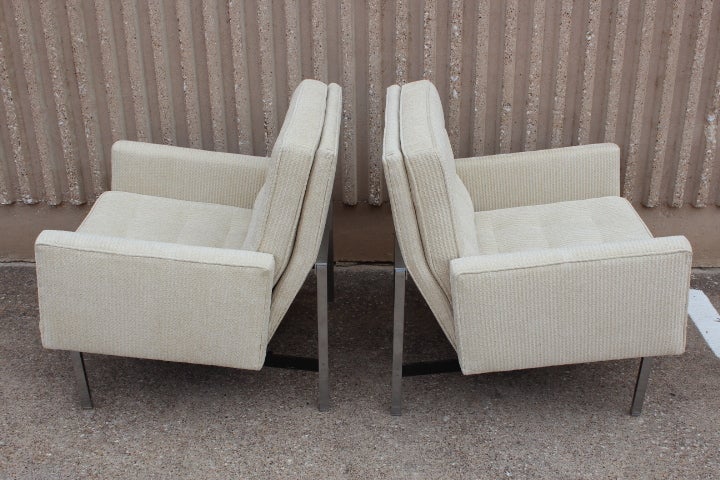 A pair of Parallel bar armed lounge chairs designed by Florence Knoll for Knoll.