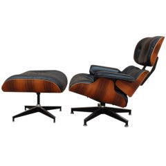 Rosewood lounge chair/ottoman by Charles Eames