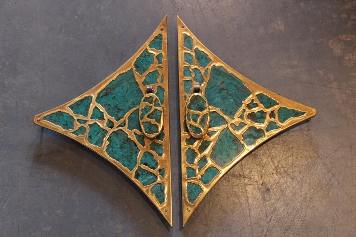 There are three sets of these brass and malachite handles available. The large scale is perfect to build a custom set of nightstands or cabinets around. The price listed is for one set which consists of a left and right. Although unsigned, these are