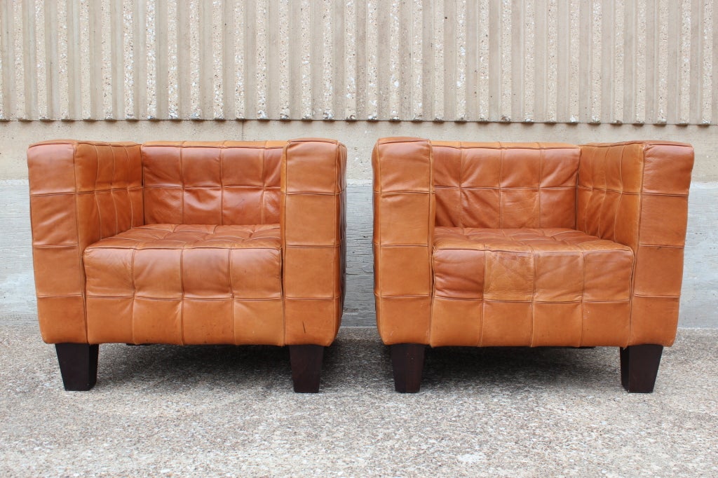 A pair of leather Kubus chairs with incredible patina attributed to Josef Hoffman.
