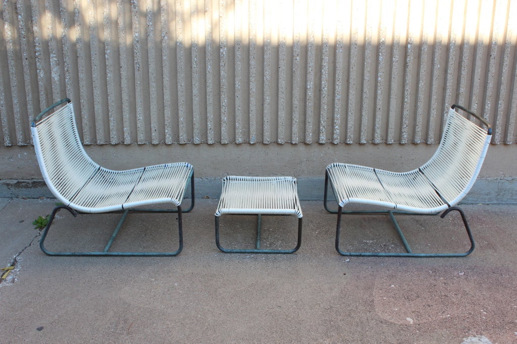 Pair of low lounge chairs and ottoman by Walter lamb