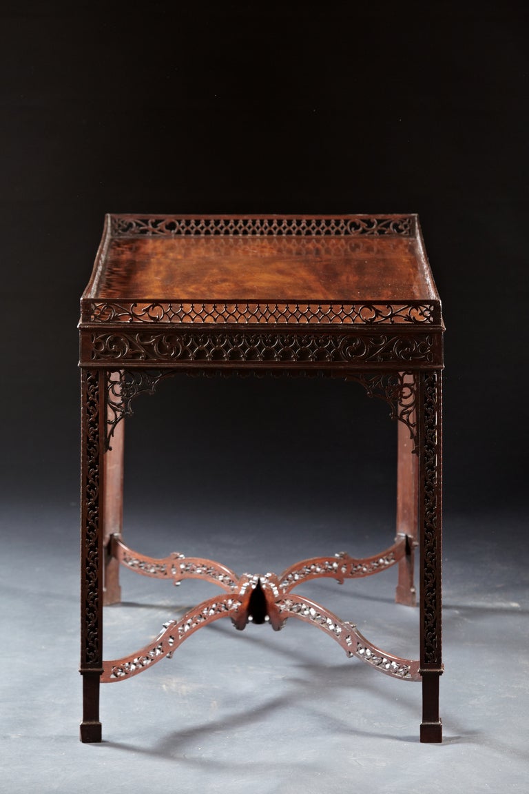  	A Chippendale fretwork tea/silver table in mahogany. Featured in 