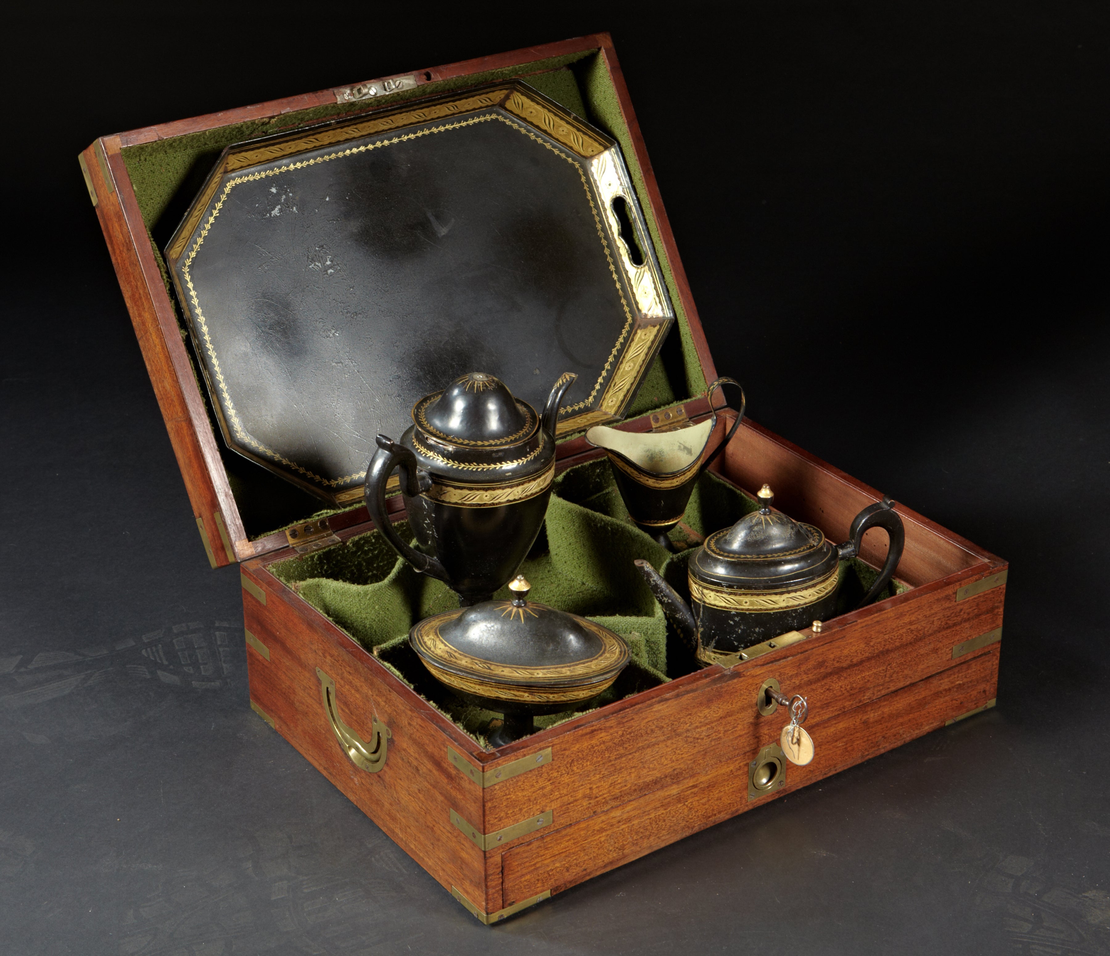 An English Regency Campaign Type Boxed Tole Tea Set For Sale