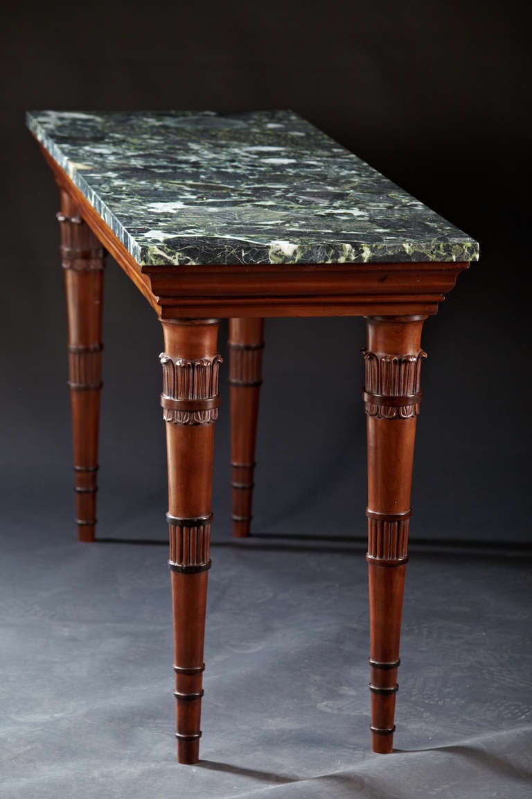 A Narrow English Regency Mahogany and Marble Top Center Table