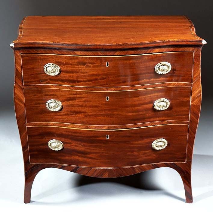 18th Century and Earlier An English Hepplewhite Period Serpentine Chest in Mahogany