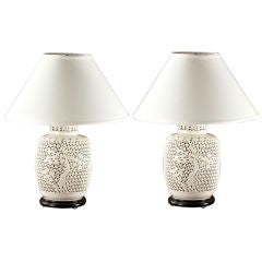 A pair of Pierced Porcelain Blanc de Chine Lamps, Lit Internal