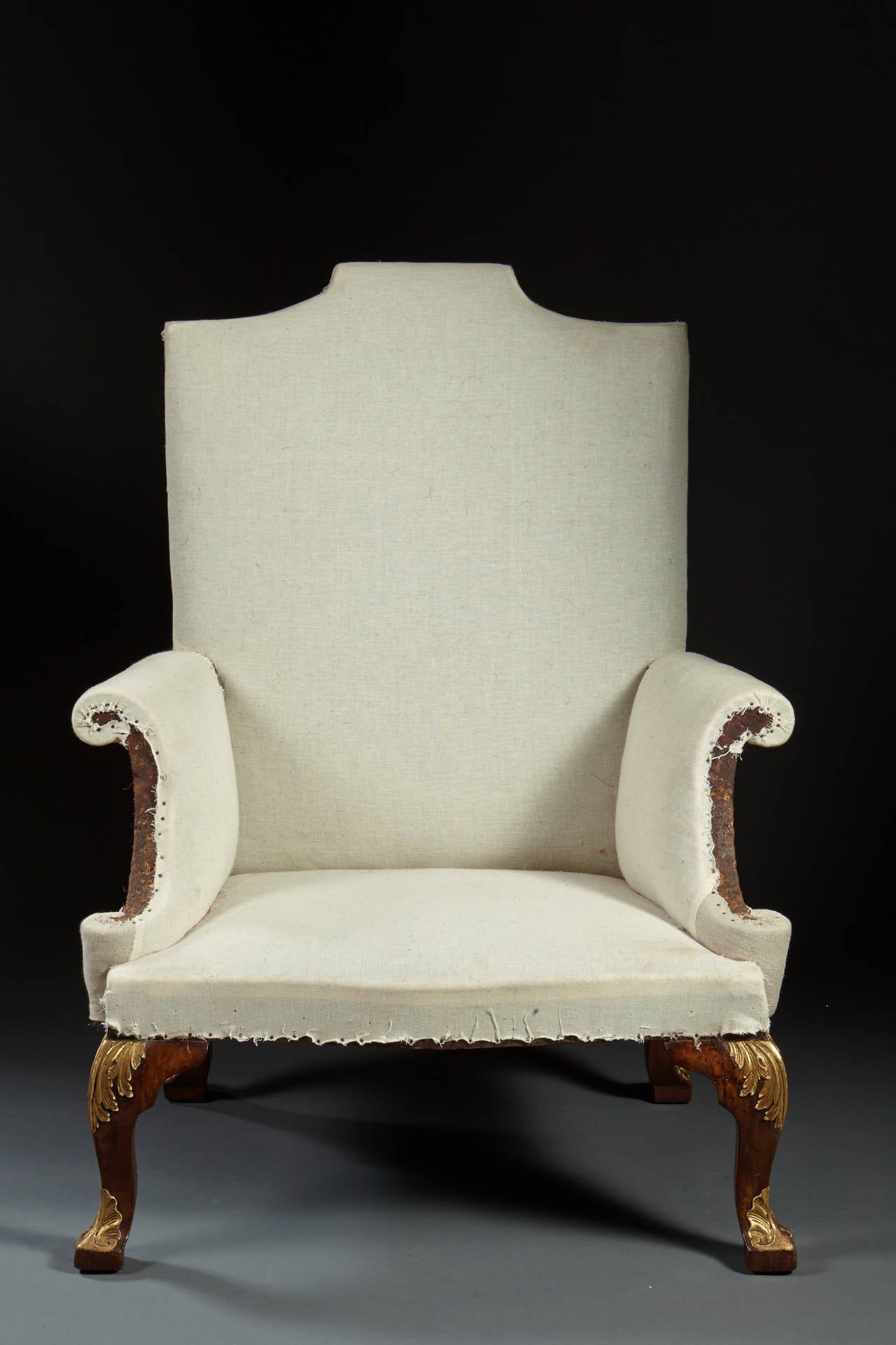 An important Kentian walnut easy chair with scrolled crest, flared arms and square cabriole legs with gilt carved acanthus knees, English, George II, circa 1735. A great find! All original and a rare example of the storied period of style.
Frame