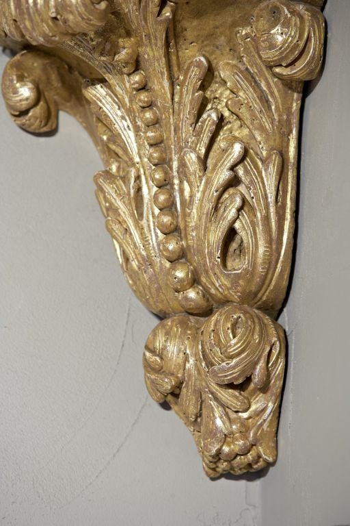 An Unusual Pair of English George II Giltwood Corner Brackets For Sale 1