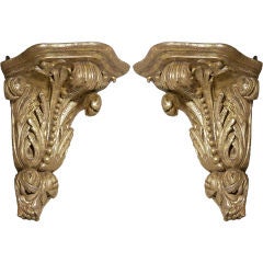 An Unusual Pair of English George II Giltwood Corner Brackets