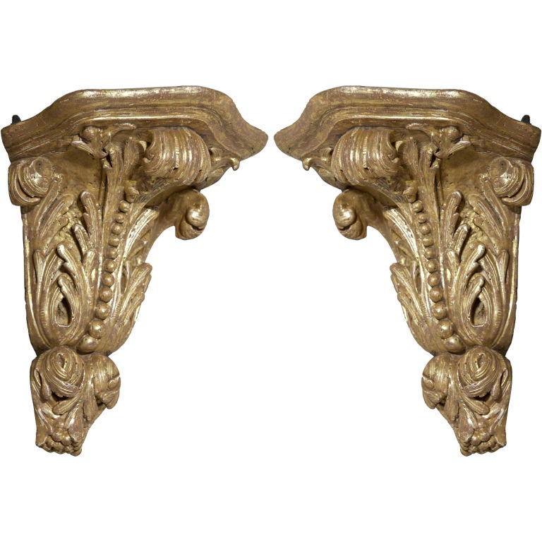 An Unusual Pair of English George II Giltwood Corner Brackets For Sale