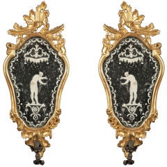 A pair of Italian Giltwood Etched Mirrors with Sconce Arms