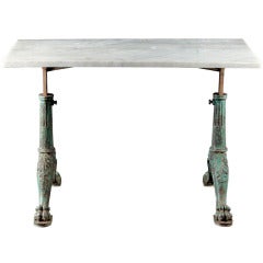 A 19th Century Painted Iron and Marble Trestle Slab Table