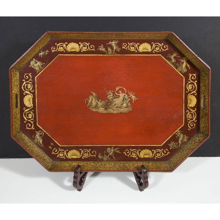 A very fine and original English Regency period papier mache tray of rectangular form with canted corners and painted with a central mythical scene surrounded by vignettes of gods and foliate decorated shells. The condition is excellent and the red