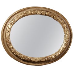 A Giltwood Husk Carved Oval Mirror, Vertical or Horizontal