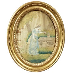 An English  Oval Giltwood Frame with Silk Needlework Scene
