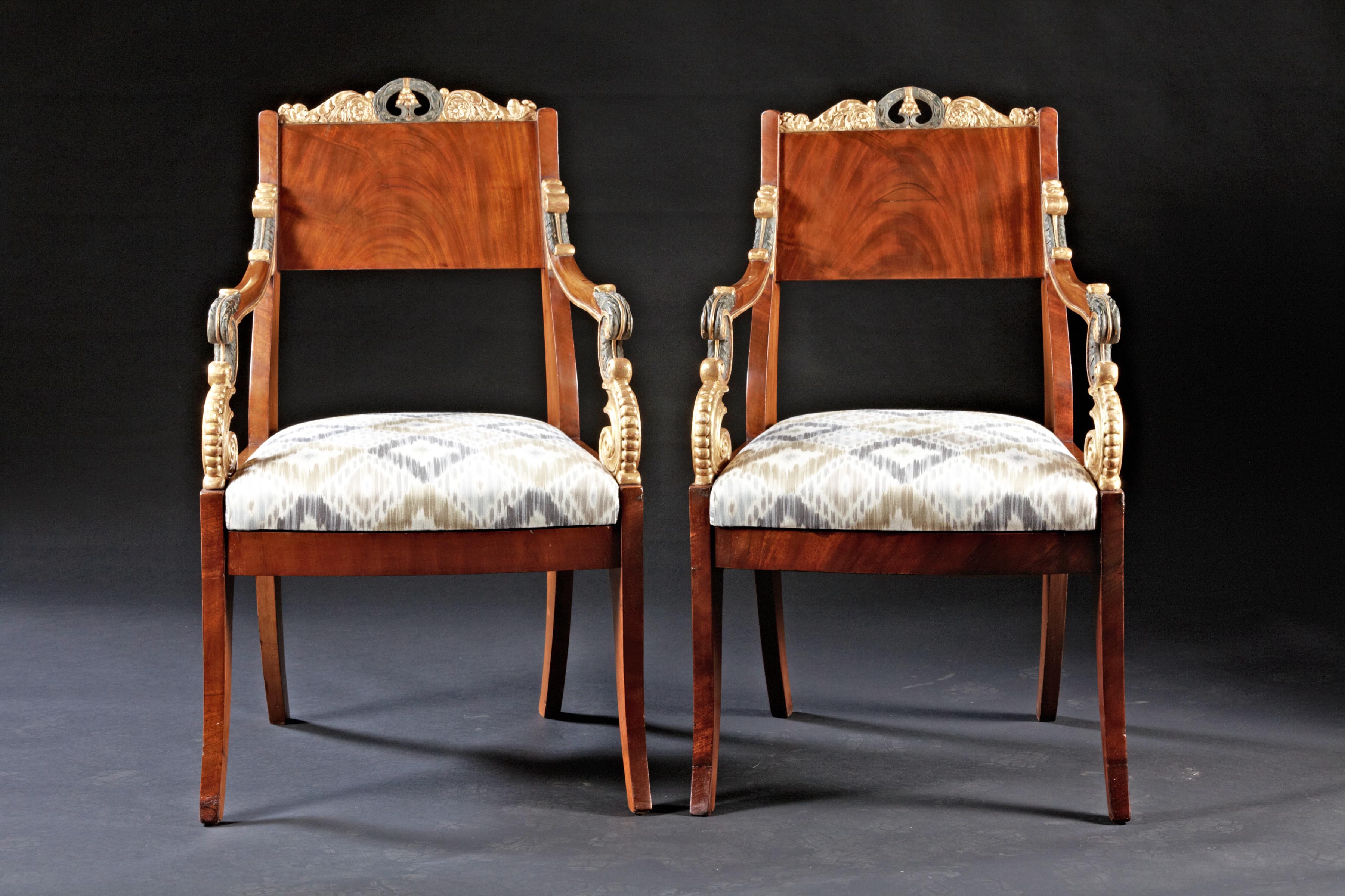 A Fine Pair of Russian Parcel Gilt Mahogany Armchairs