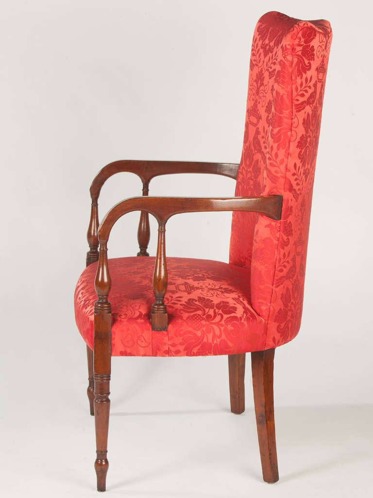 Rare New England large-scale Lolling chair with a shaped crest
double arm supports which indicate a Portsmouth N. H. origin
and inlay on the arms all in mahogany.