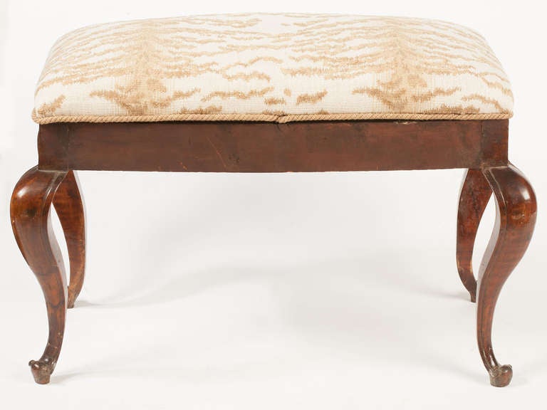 Venetian 19th century walnut shaped front stool with  exaggerated cabriole legs,
the back not finished so it was probably used at the foot of a bed
