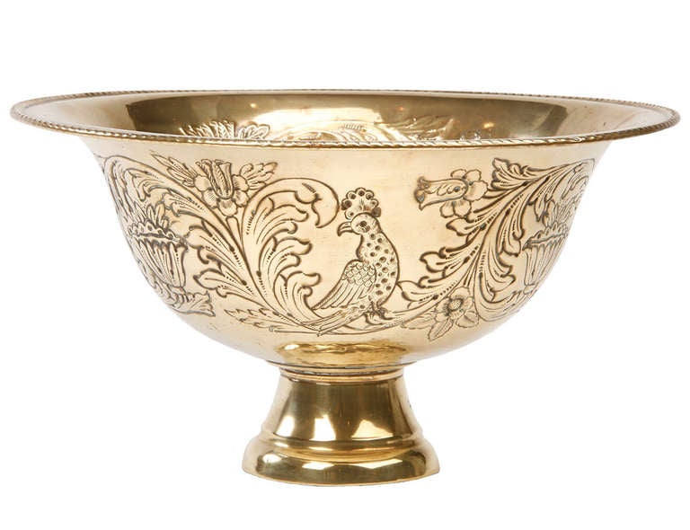 Large Dutch brass repousse bowl decorated with birds and flowers.