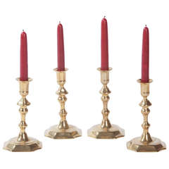 Assembled set of Four Brass George II candlesticks