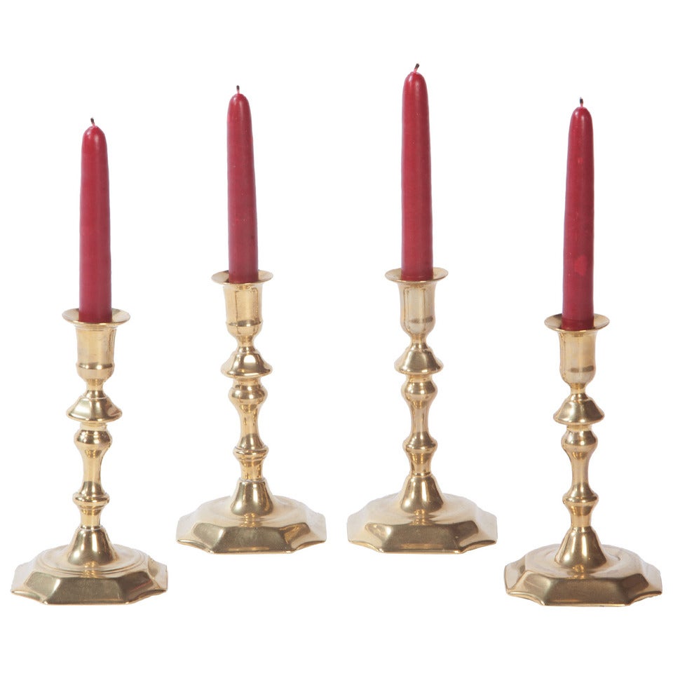 Assembled set of Four Brass George II candlesticks For Sale