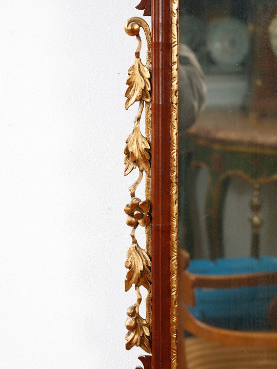 Mahogany and gilt Chippendale mirror with a Phoenix ornament<br />
and side leaves