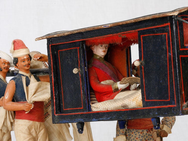 Anglo-Indian model of a Palanquin with a Western passenger<br />
being transported by native bearers. A similar example in the<br />
collection of the Peabody Essex Museum and illustrated in their<br />
publication Yankee India by Susan S. Bean