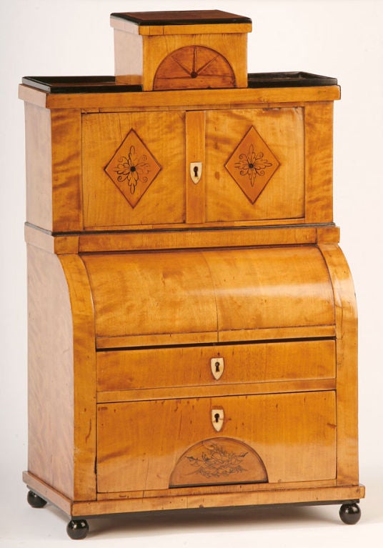 A rare form in miniature furniture A cylinder front Biedermeier secretary 
in birch with engraved decoration.