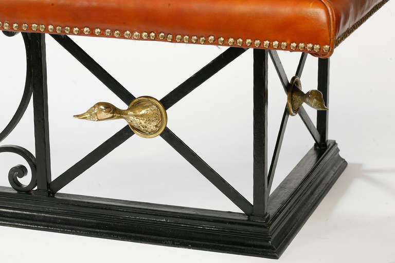 Quite unusual iron and brass leather upholstered fender
with brass duck heads from the collection of Dillon Ripley formerly the head of the Smithsonian Institute purchased from his daughter.