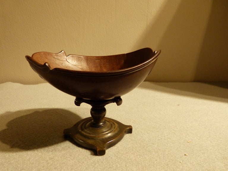 An 18th century carved coconut cup on stand