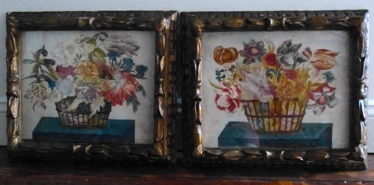 A fine and decorative pair of 19th century floral still life watercolor paintings on paper depicting an assortment of flowers in wicker vase, circa 1880.