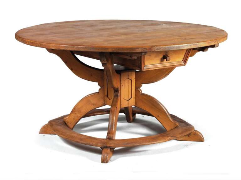 Large round table with a five-foot diameter and a conceptual design.
Interesting, rare model, one deep drawer that can be removed if a lighter appearance is desired. Round top supported by a shaped X-construction, joined by rounded. Flat