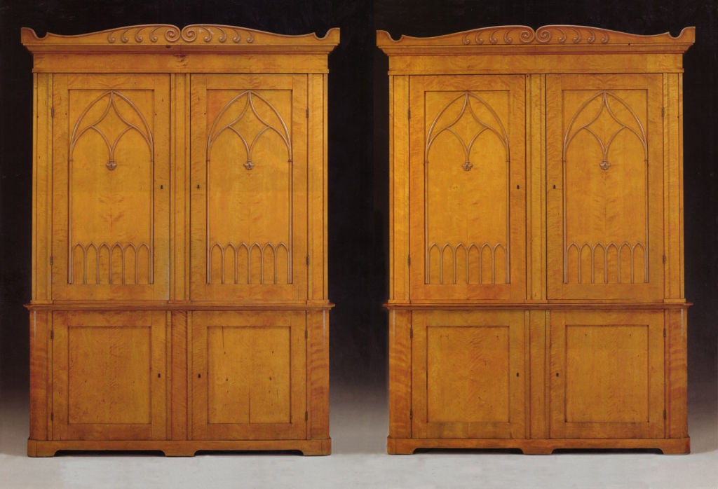 Monumental pair of oversized Neogothic cabinets. Each of the top parts is fitted with shelves, one of the cabinet's bottom part has a shelved interior the other is fitted with 45 small drawers. Beautiful color and well matched satin-birch veneer.