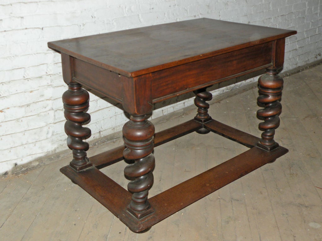 Center table with unusual bold spiral turned legs, flat box stretcher and bun feet.
