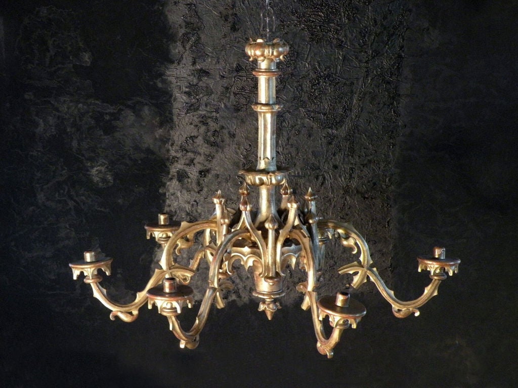 Decorative six-arm giltwood chandelier in the neogothic taste.
The fixture is not yet electrified.
