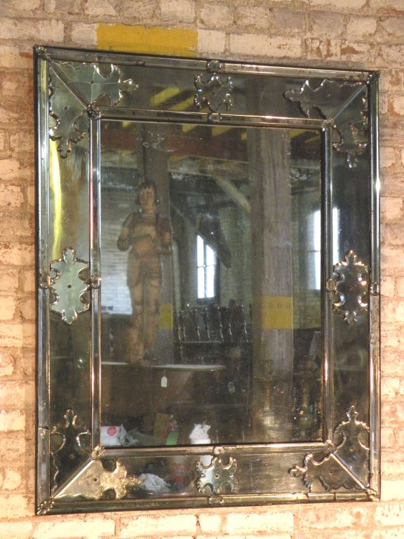 Elegant, large glass on glass mirror with beveled edges and applications.
Our pieces are left in lived-in condition, pending our custom conservation.
On consignment from a sophisticated collector.